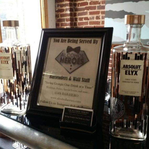 A plaque is displayed on the bar of a restaurant.