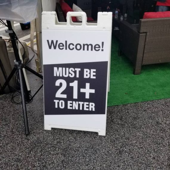 A sign that says welcome to the 2 1 plus club.