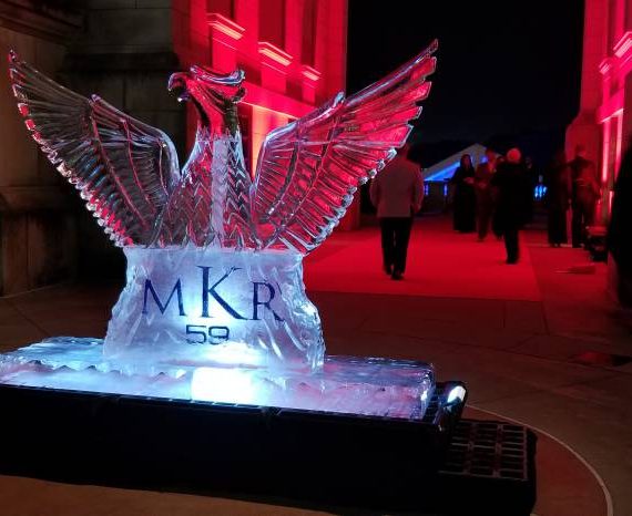 A large ice sculpture of two birds on top.