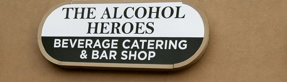 A sign that says alcohol heroes garage catering car shop.